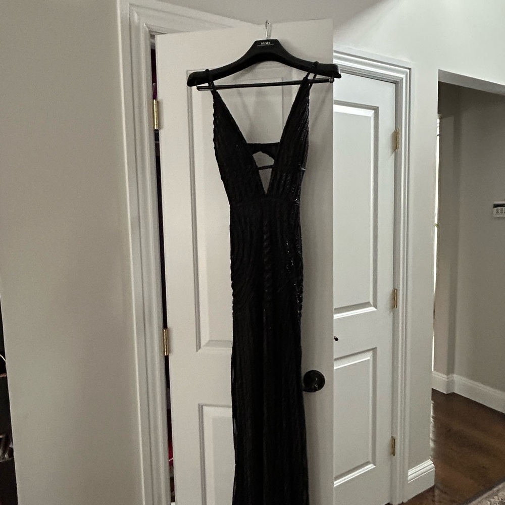 Scala Black Backless Beaded
Gown perfect mix of elegance, class and sexy fun